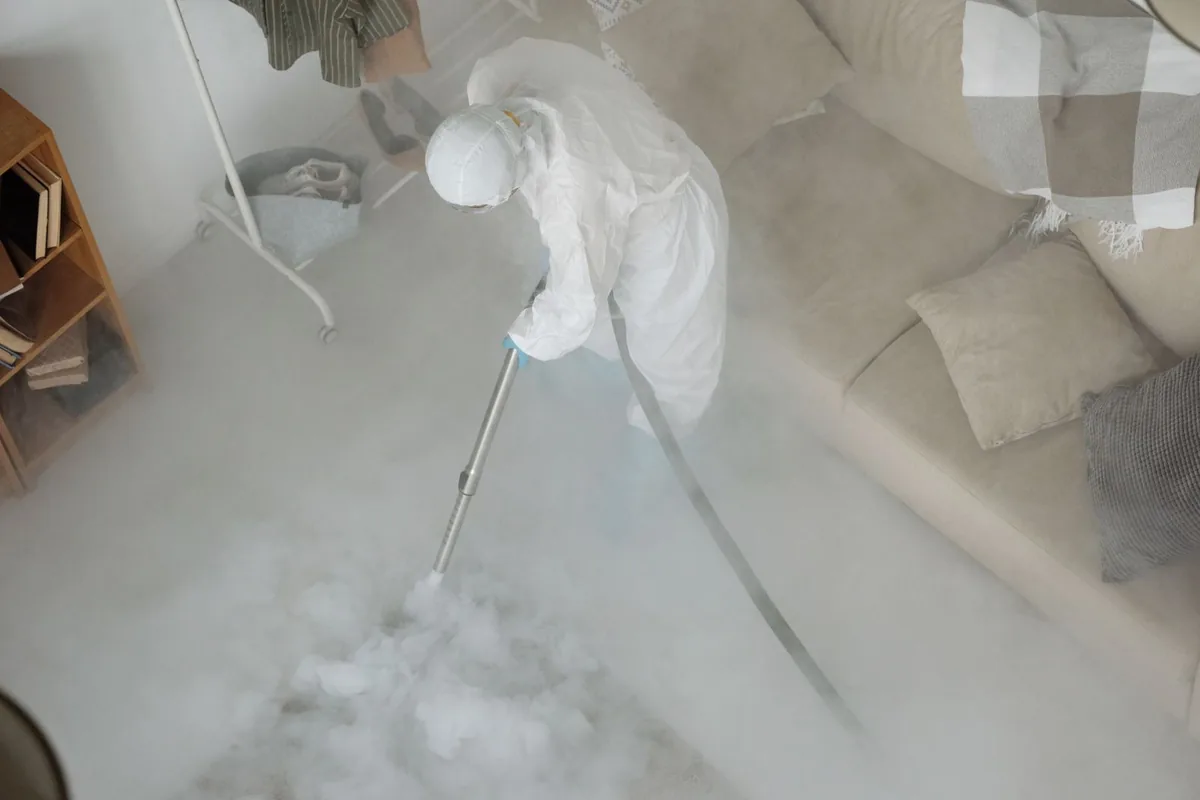 Biohazard cleanup technician in protective equipment, Milwaukee, WI